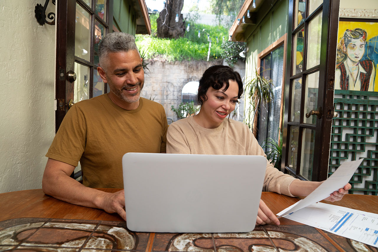 Couple at home working on bills together