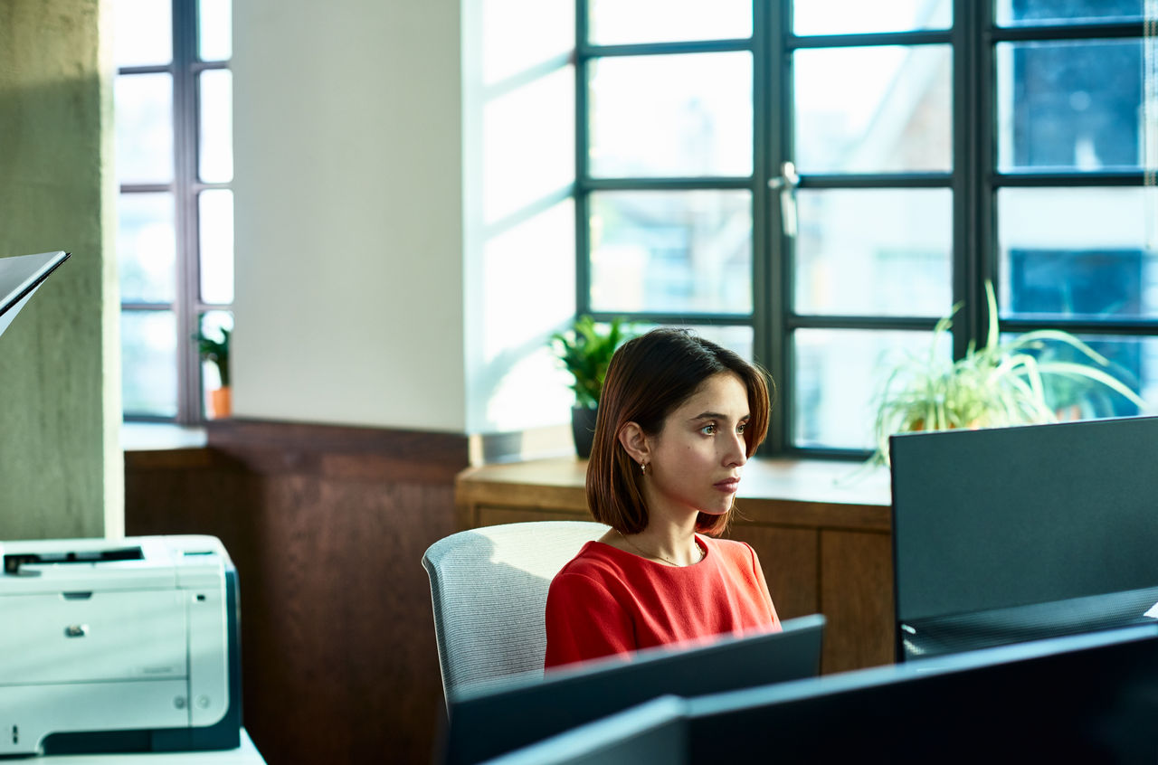 Businesswoman working at the office focused on computer