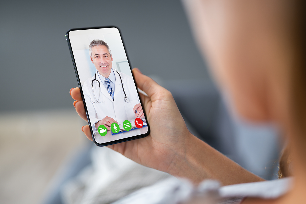 Patient videochatting with doctor on mobile phone